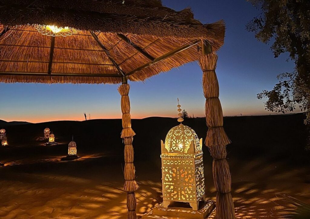 Desert camp lantern dusk pergola, Morocco