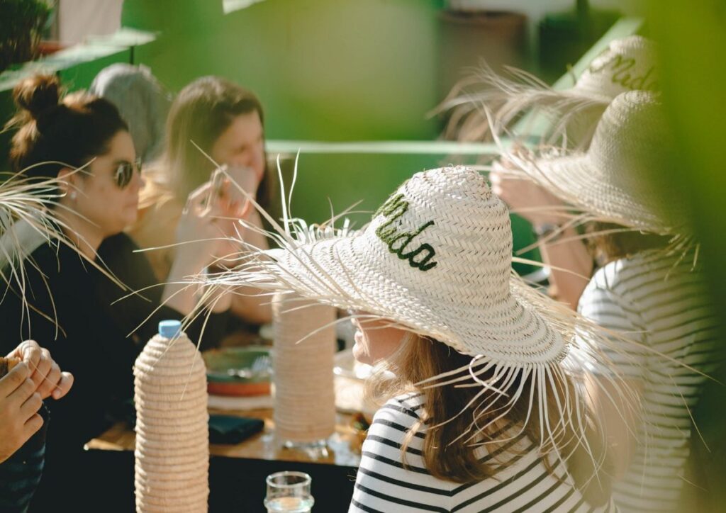 Friends dining table hats travel, Morocco