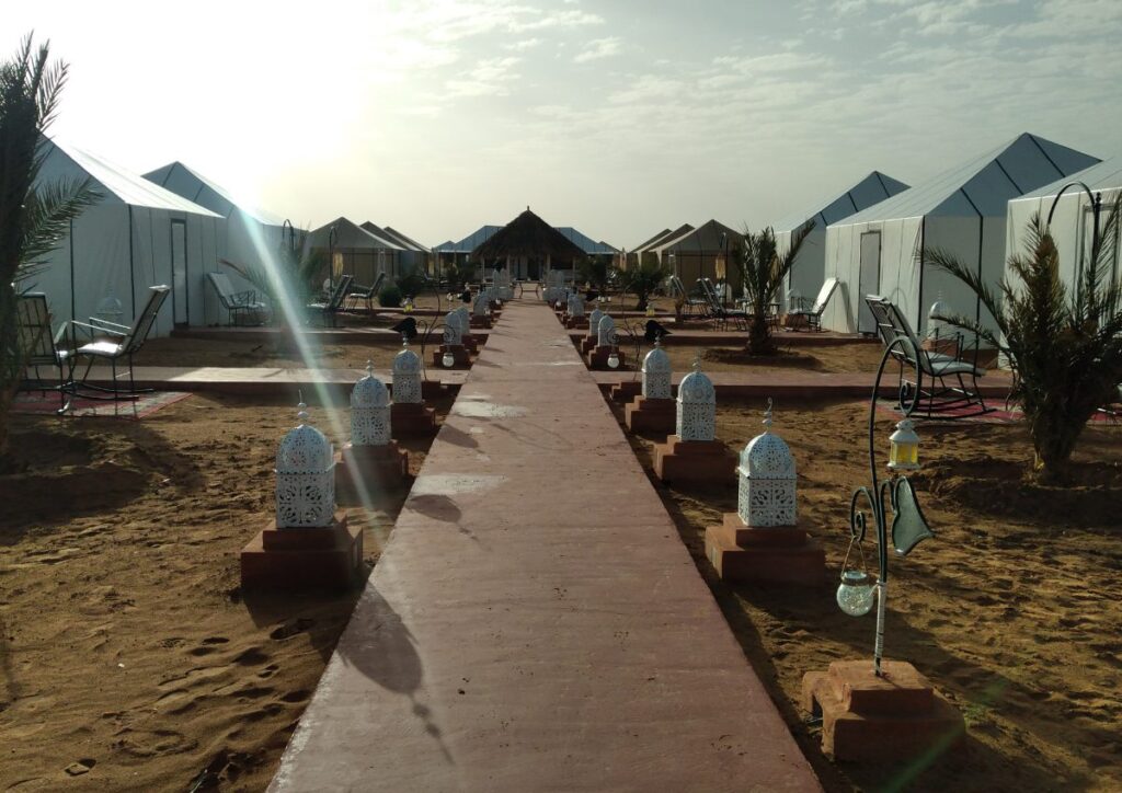 Luxury desert camp tents sunrise, Morocco